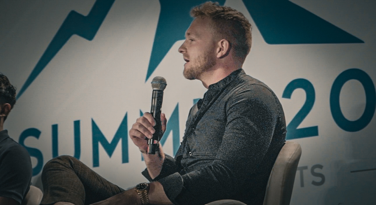 Josh Barnes speaking on stage